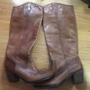 Tall brown heeled leather boots